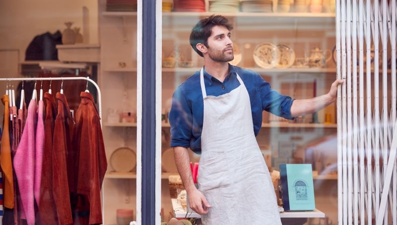 Shopkeeper opening store