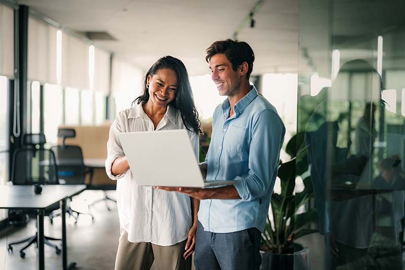 people looking at a computer